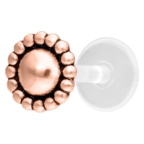 Roségoldenes Nub Labret Push-Fit Piercing auf weißem Hintergrund